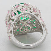 Elegant round green emerald sterling silver ring with pink accent stones and intricate design.